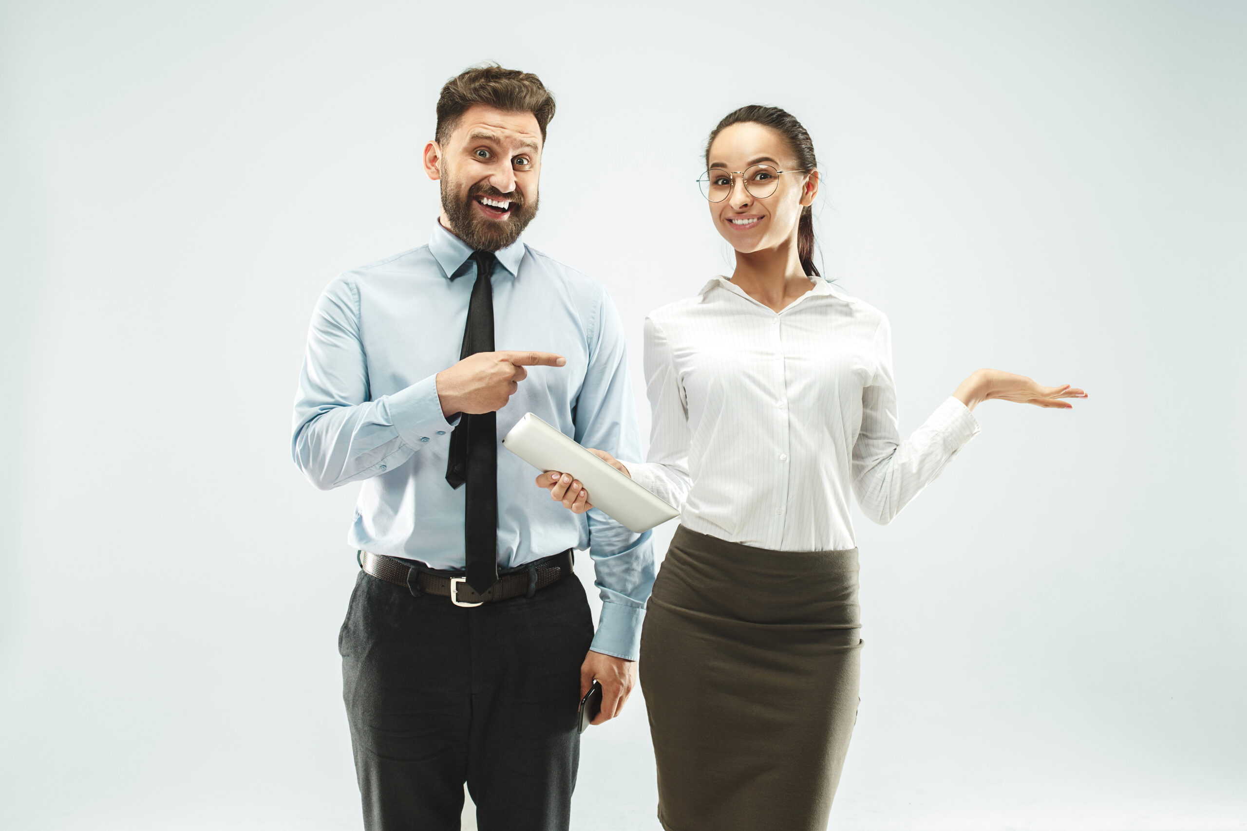 Business man pointing to a business woman