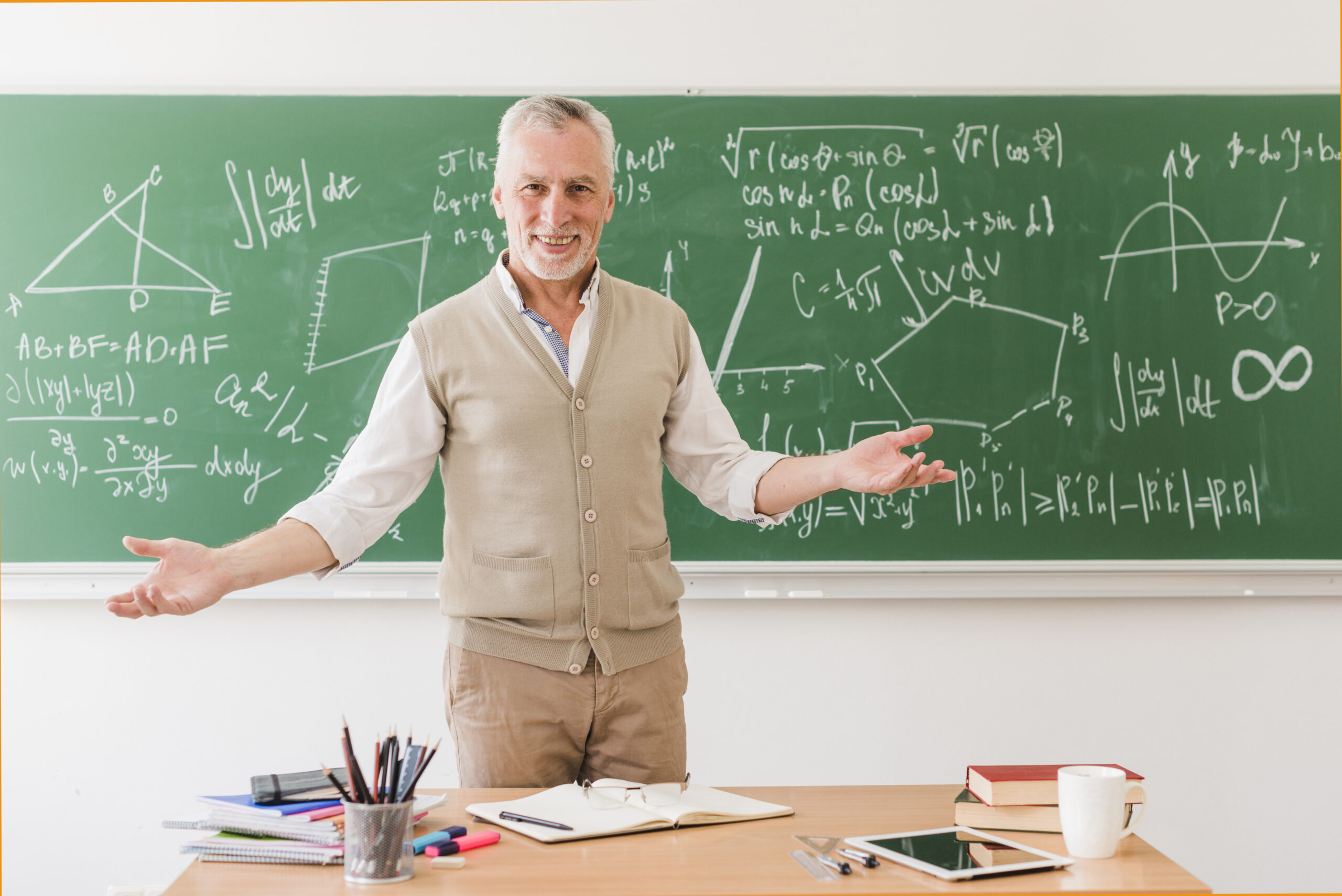 Math teacher in front of chalkboard